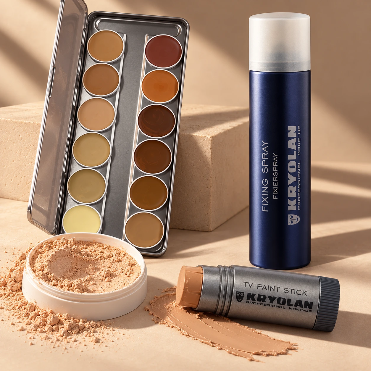 Paleta Supracolor, Fixing Spray, TV Paint Stick y Fixing Powder sobre fondo nude